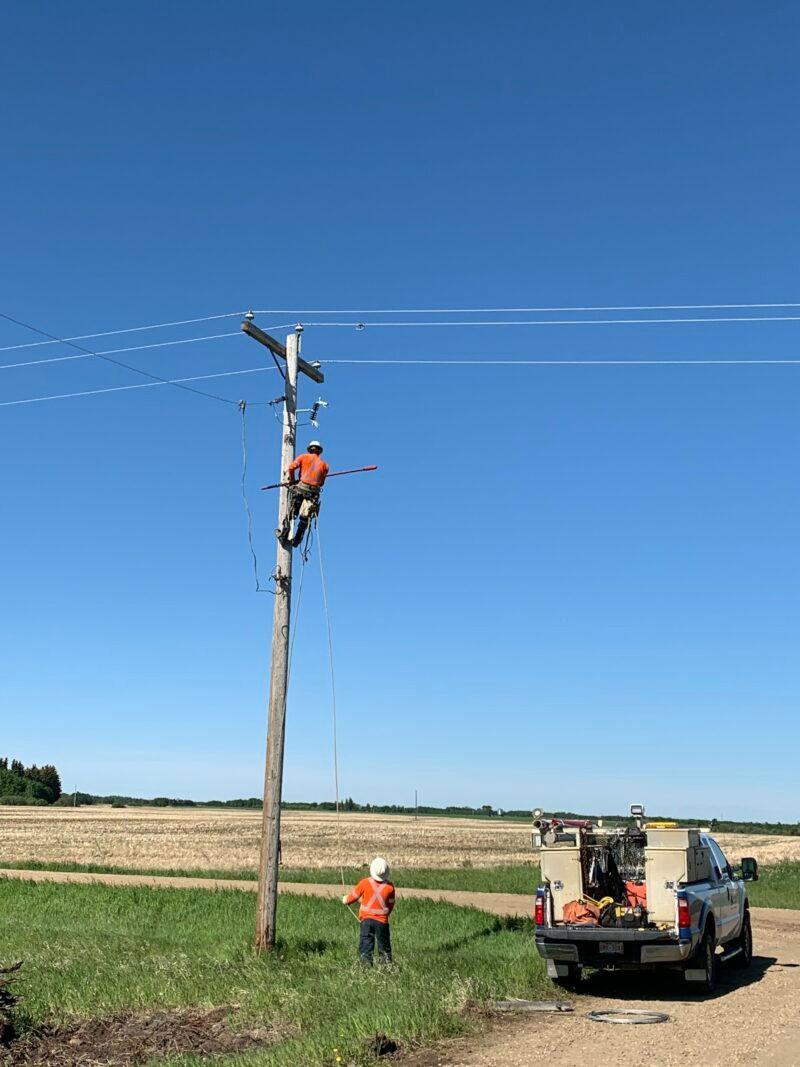 power line technician and lift truck